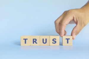 "Trust" spelled in blocks