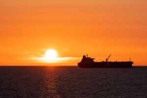 Gas Fuel Tanker Ship Sailing In The Sunset